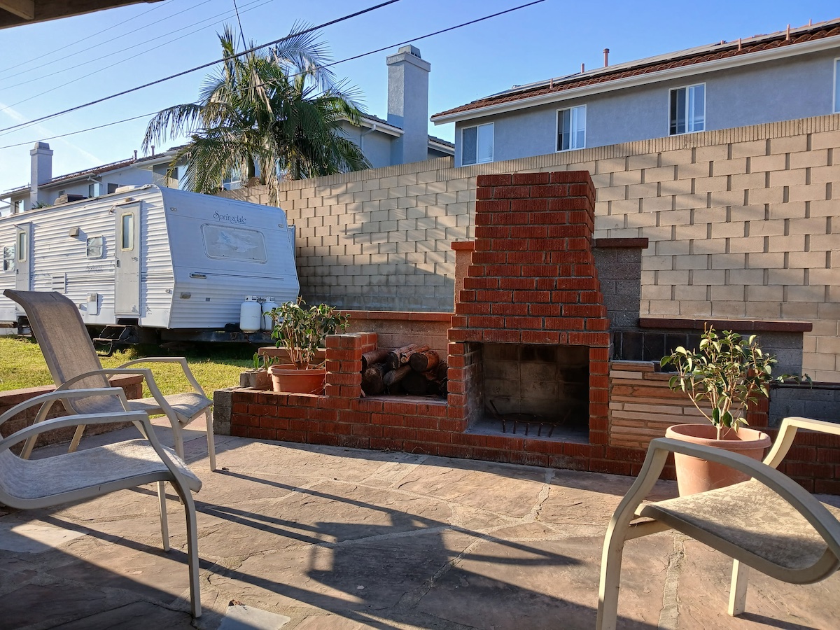 Outdoor fireplace and seating area on property