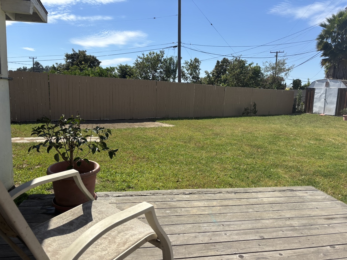Open backyard with lawn — perfect RV parking space